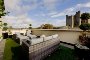 View of Trim Castle from balcony seating area in Trim Castle Hotel